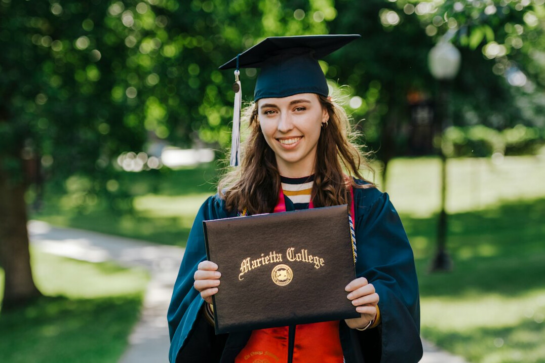 graduation cap on laptop