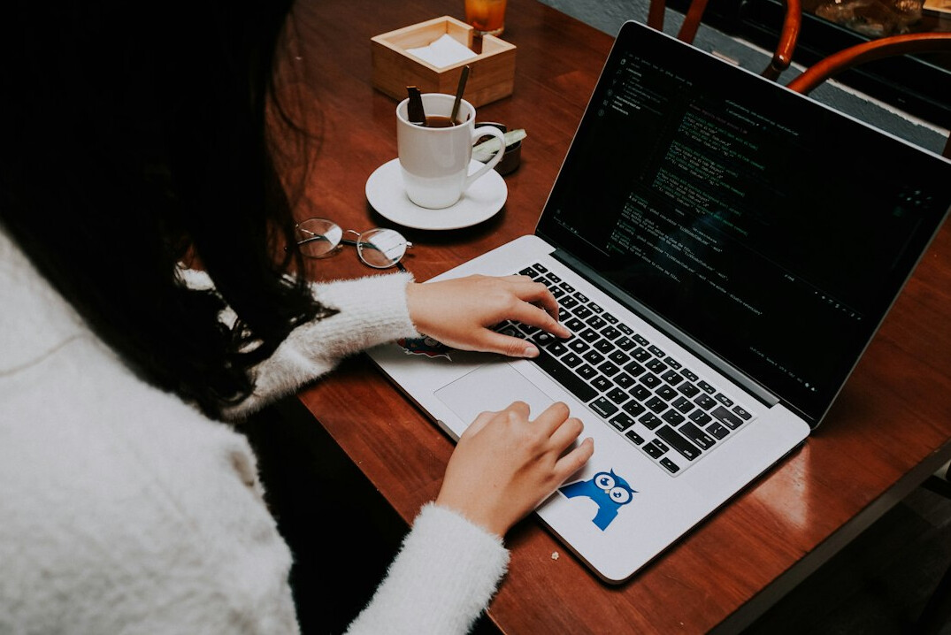 person coding on laptop daily life