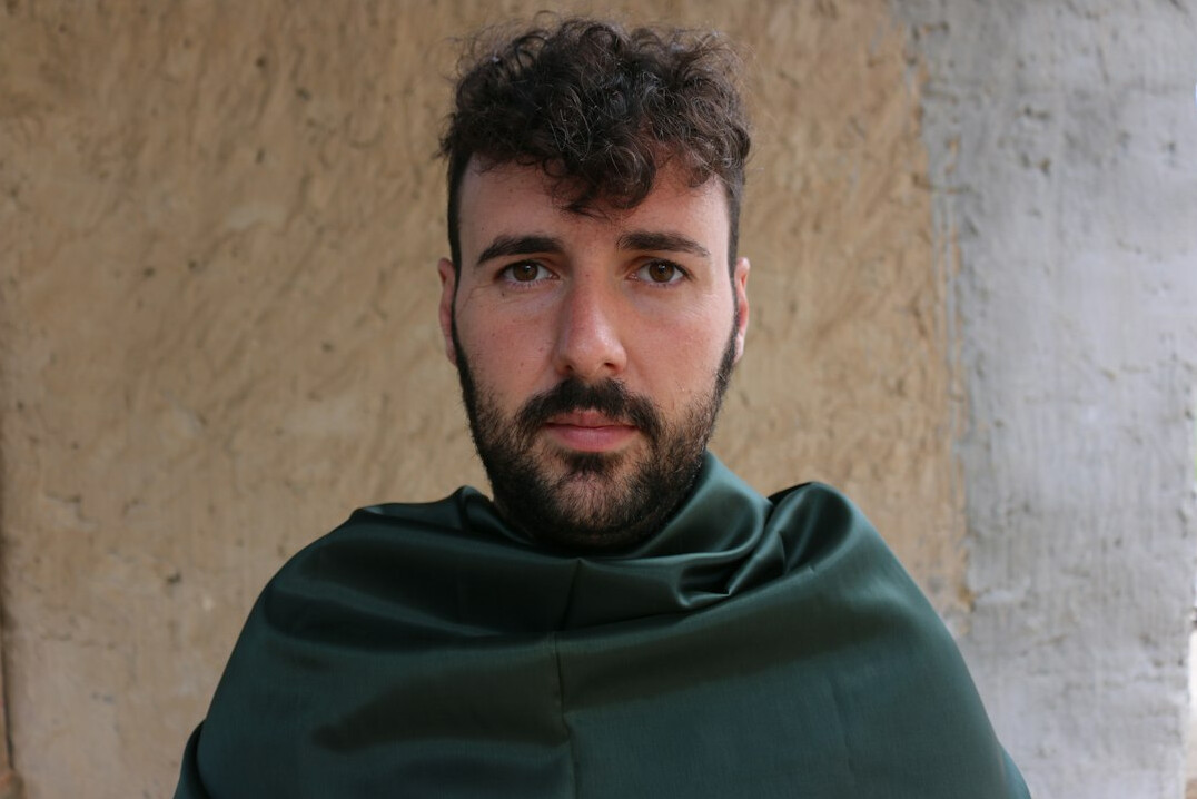 Portrait of a man with a short beard looking at the camera