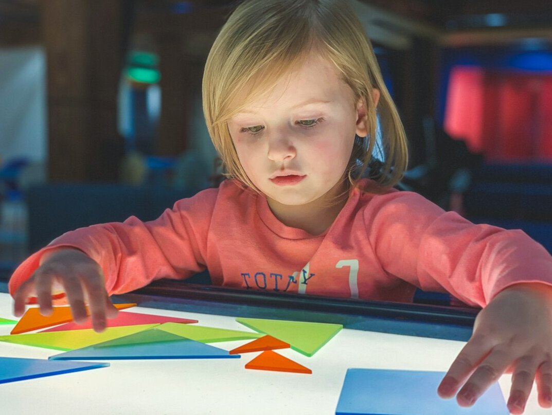 girl playing coding game